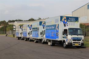 4 Plumbing Trucks Lined Up